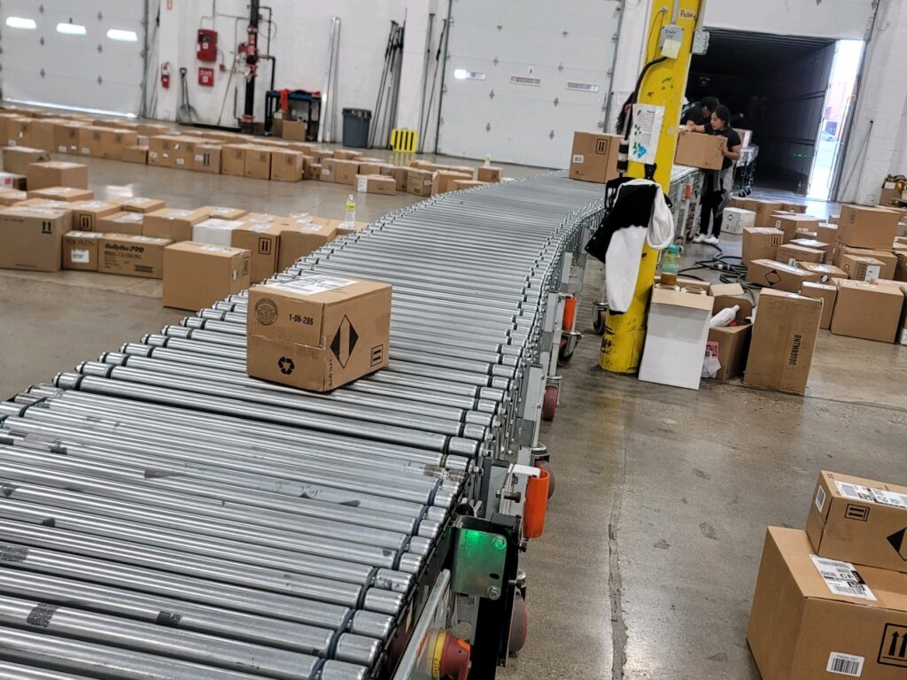 cost-effective retail pool distribution solutions - packaging on conveyor belt.