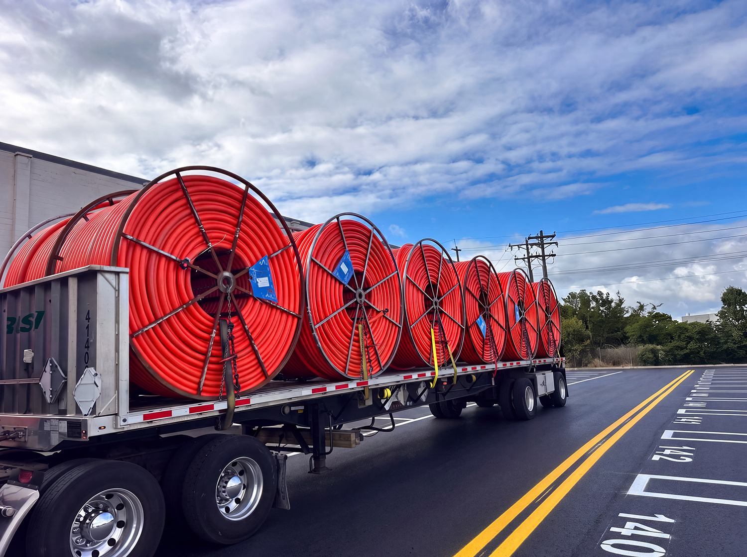 flatbed with large coiled reels